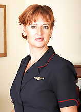Milf Flight Attendant Liddy Strips Off Her Uniform And Spreads In Here