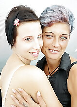 Old And Young Lesbian Couple Make Out On The Couch
